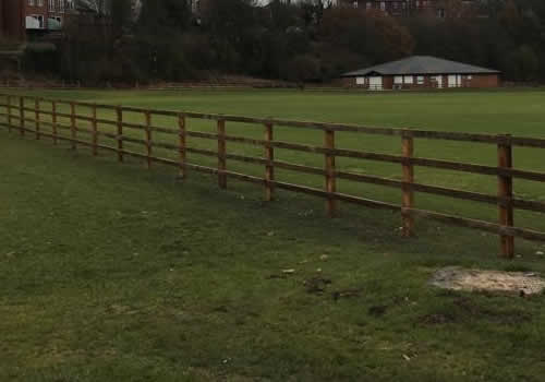 long run of ranch fencing in field